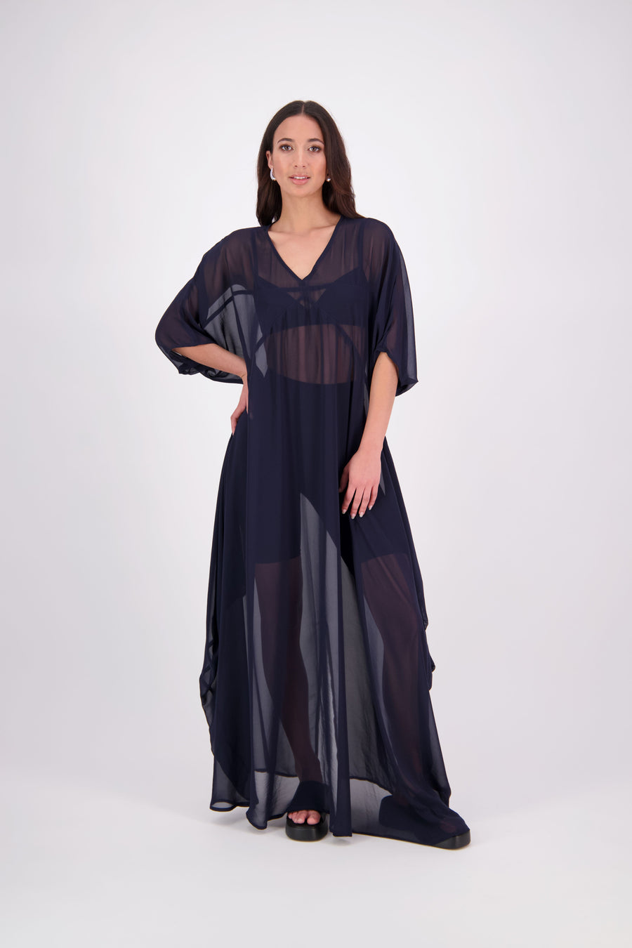 The N-E-S Remi Dress is a dreamy maxi style crafted in sheer chiffon, designed to be worn over a N-E-S Lattice Slip. Featuring floaty kimono sleeves, a soft V-neckline with a scoop back (or wear it reversed), and a slight barrel hem created by unique side seam panels that flow from the centre front. Finished at lower calf length for graceful movement—this dress brings effortless elegance to any occasion.
Our model is 174cm and wears XS/S (8-10)
Composition: polyester Chiffon
Designed in New Zealand
