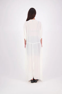 The N-E-S Remi Dress is a dreamy maxi style crafted in sheer chiffon, designed to be worn over a N-E-S Lattice Slip. Featuring floaty kimono sleeves, a soft V-neckline with a scoop back (or wear it reversed), and a slight barrel hem created by unique side seam panels that flow from the centre front. Finished at lower calf length for graceful movement—this dress brings effortless elegance to any occasion.
Our model is 174cm and wears XS/S (8-10)
Composition: polyester Chiffon
Designed in New Zealand