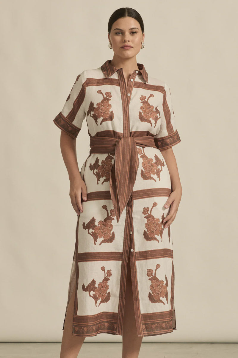 The roam dress is cut in airy linen, finished with thoughtful trim and a side split for relaxed movement. With an exclusive print crafted in luxurious and timeless mocha hues this makes the roam dress perfect for resort styling or everyday luxury.

crisp collar and covered placket deliver refined finish
custom zk exclusive coffee collage print
wide self-tie belt for tailored shape
side split and relaxed fit offer comfort and movement
finished hem and sleeve trim for elevated detail
vacation-ready and trans-