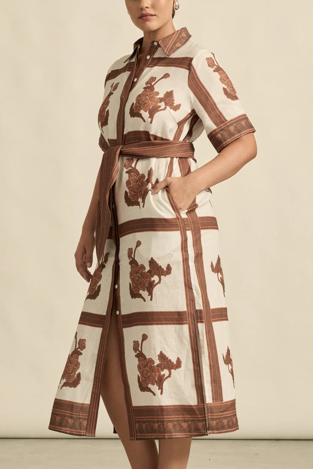 The roam dress is cut in airy linen, finished with thoughtful trim and a side split for relaxed movement. With an exclusive print crafted in luxurious and timeless mocha hues this makes the roam dress perfect for resort styling or everyday luxury.

crisp collar and covered placket deliver refined finish
custom zk exclusive coffee collage print
wide self-tie belt for tailored shape
side split and relaxed fit offer comfort and movement
finished hem and sleeve trim for elevated detail
vacation-ready and trans-
