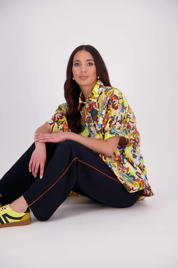 Ryn Shirt – Effortless Volume &amp; Soft Structure

The N-E-S Ryn Shirt is a COTTON SHIRT modern take on a classic, crafted in breathable cotton. With its umbrella-style silhouette, it features a centre front button-down placket, kimono-style sleeves gathered into soft cuffs, and a slight high-low hem. Easy to style back with pants, shorts, or skirts—this is your go-to shirt for relaxed yet elevated dressing.