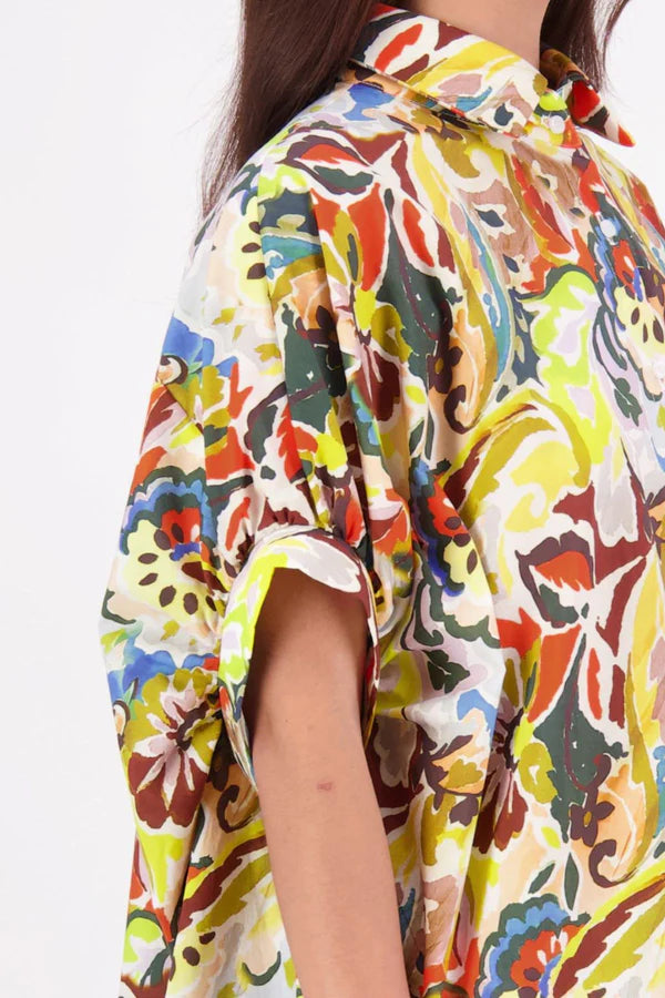 Ryn Shirt – Effortless Volume &amp; Soft Structure

The N-E-S Ryn Shirt is a COTTON SHIRT modern take on a classic, crafted in breathable cotton. With its umbrella-style silhouette, it features a centre front button-down placket, kimono-style sleeves gathered into soft cuffs, and a slight high-low hem. Easy to style back with pants, shorts, or skirts—this is your go-to shirt for relaxed yet elevated dressing.