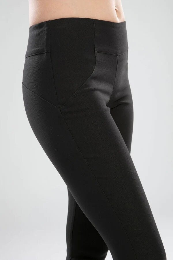 The NES Skinnie Minnies Pant is your go-to for sleek, everyday style with a modern edge. Crafted from the same super stretchy twill fabric you love, these pants are all about a flattering fit and effortless comfort. Featuring a cigarette-style slim leg, flat waistband, and a concealed side seam zip, the Skinnie Minnies offer a streamlined silhouette that's both polished and wearable.
