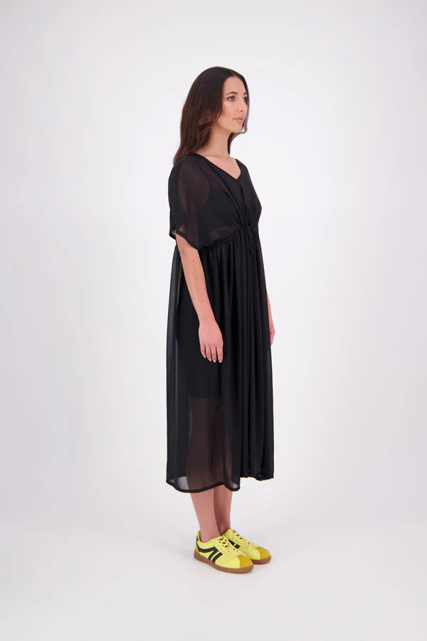 Tara Dress – Effortless, Floaty &amp; Reversible

The N-E-S Tara Dress is a one-size, oversized silhouette made from lightweight chiffon for a breezy, elegant drape. Featuring cap sleeves, a front yoke, and a drawcord at the back, this style can be worn reversed for added versatility. Finished with a soft V-neck at the back or front and a hem that falls just below the knees, it’s the perfect throw-on piece for effortless summer dressing.