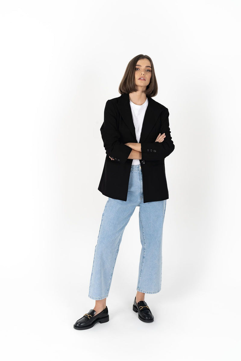 The Cosmo Blazer will instantly add effortless sophistication to any outfit! Lightweight enough to not feel heavy or restrictive but will still provide that extra layer of warmth. We love wearing her with jeans and a white tee for a chic weekend look, or pair with a pant or skirt to create a classic suit for days in the office.

Smart casual blazer with a soft, boxy silhouette.
Small subtle shoulder pads.
Lined collar with fold back lapel.
Lightweight, soft, stretch fabric with beautiful drape.
Functional p