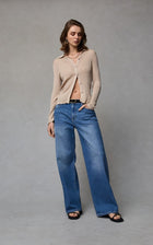 Dricoper Zelda jeans in Rodeo Blue, designed with a relaxed baggy fit, mid-to-high rise waist, and wide loose legs that fall to the floor for a laid-back ’90s-inspired look.