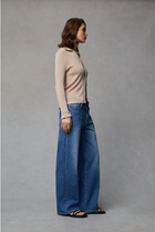 Dricoper Zelda jeans in Rodeo Blue, designed with a relaxed baggy fit, mid-to-high rise waist, and wide loose legs that fall to the floor for a laid-back ’90s-inspired look.