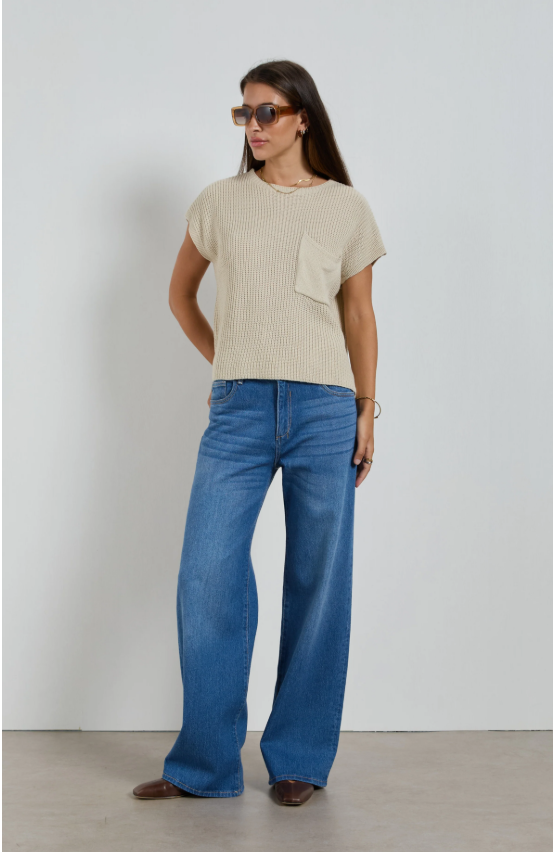 Dricoper Zelda jeans in Rodeo Blue, designed with a relaxed baggy fit, mid-to-high rise waist, and wide loose legs that fall to the floor for a laid-back ’90s-inspired look.