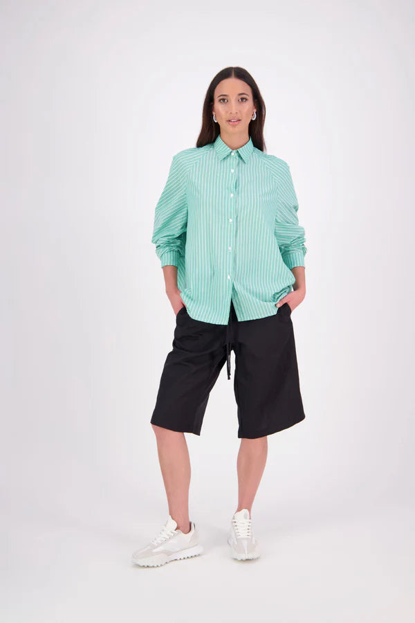 Zola cotton Shirt – Effortless Volume, Elevated Detail

The N-E-S Zola Shirt is a kimono-style oversized shirt with a relaxed, modern silhouette. Featuring a horizontal drop-back panel for added movement, 7/8 sleeves, a classic collar, centre front button placket, and button-up cuffs. A versatile piece that blends structure with flow—perfect for layering or wearing as a statement on its own.