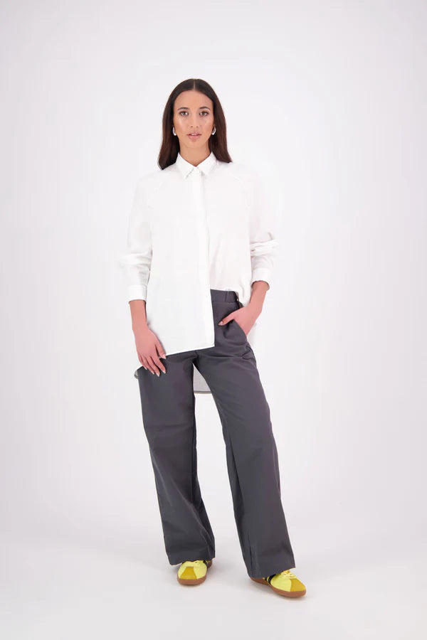 Zola cotton Shirt – Effortless Volume, Elevated Detail

The N-E-S Zola Shirt is a kimono-style oversized shirt with a relaxed, modern silhouette. Featuring a horizontal drop-back panel for added movement, 7/8 sleeves, a classic collar, centre front button placket, and button-up cuffs. A versatile piece that blends structure with flow—perfect for layering or wearing as a statement on its own.