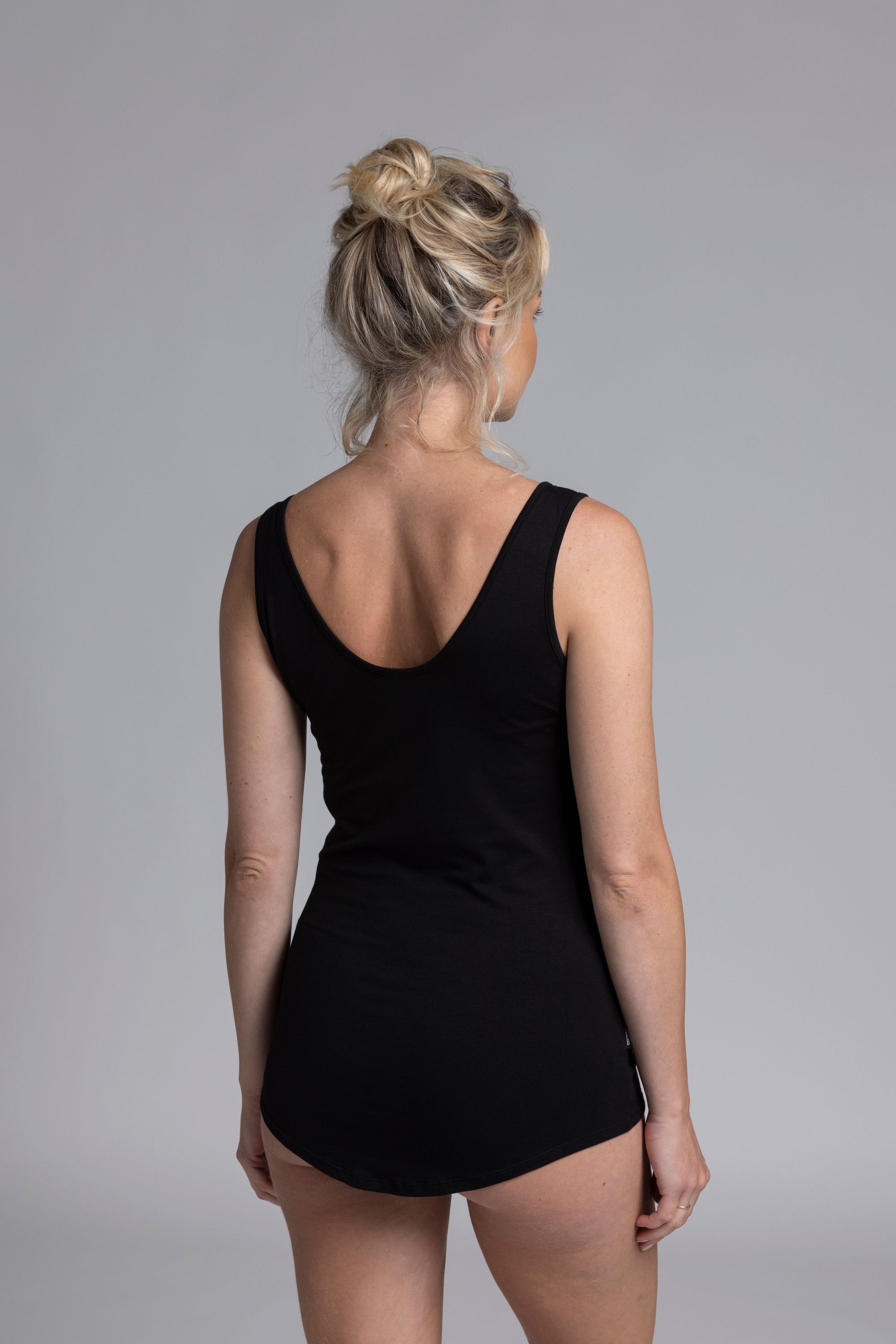 The NES Lattice Singlet is a must-have essential for every wardrobe. Crafted from a soft, stretchy knit that's not see-through, this versatile piece can be worn as an undergarment for smooth layering or styled as a top for a chic, minimalist look. Featuring fine lattice strap detailing and a reversible design, you get two stylish options in one.