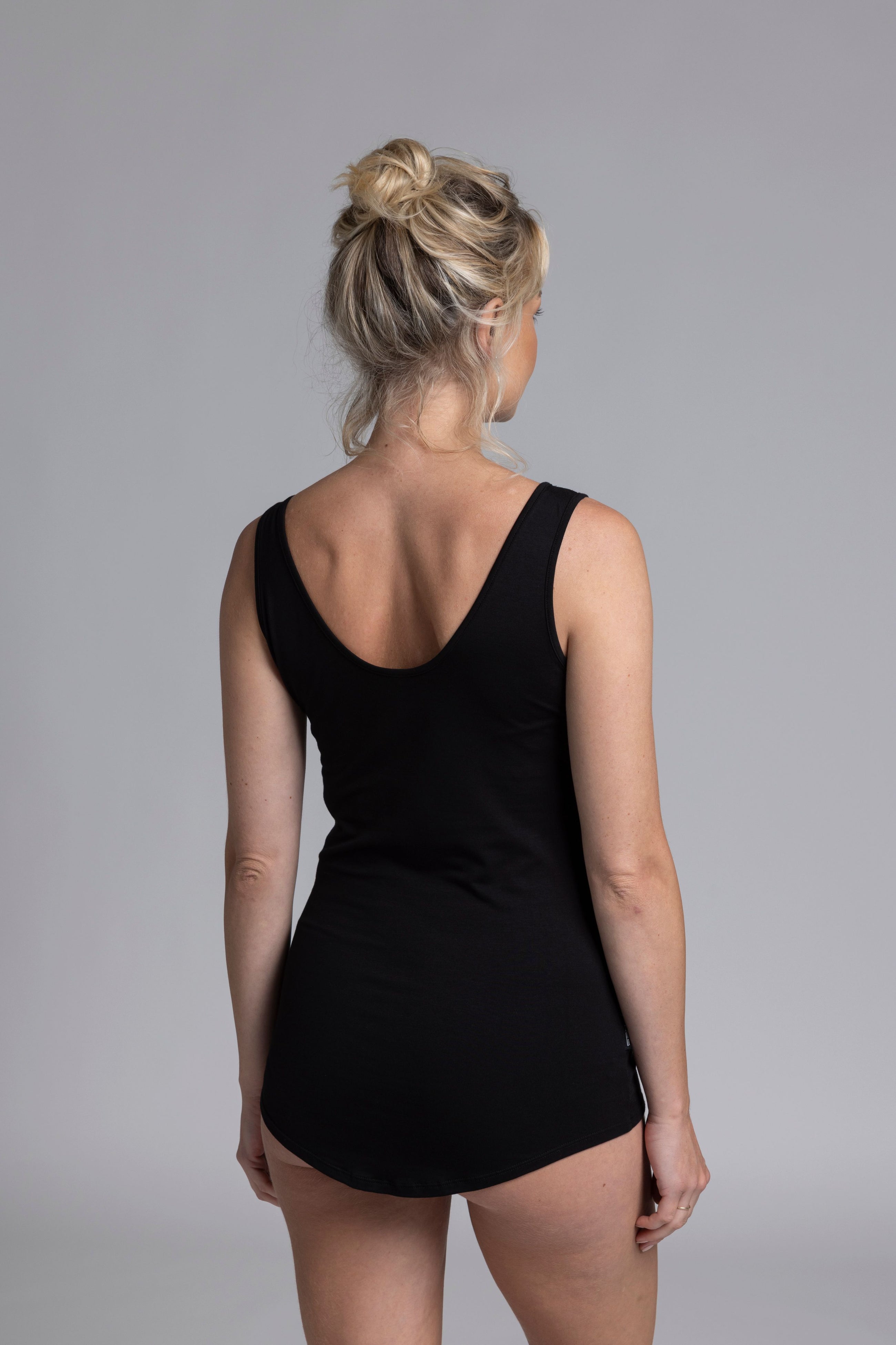 The NES Lattice Singlet is a must-have essential for every wardrobe. Crafted from a soft, stretchy knit that's not see-through, this versatile piece can be worn as an undergarment for smooth layering or styled as a top for a chic, minimalist look. Featuring fine lattice strap detailing and a reversible design, you get two stylish options in one.